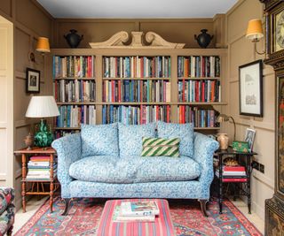 Living room with books in background on bookshelves