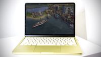 Apple MacBook Neo in Citrus colour.