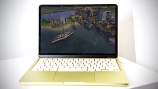 Apple MacBook Neo in Citrus colour.