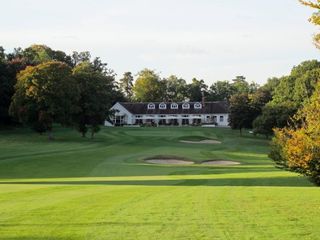 The approach to the closing hole with the welcoming clubhouse behind