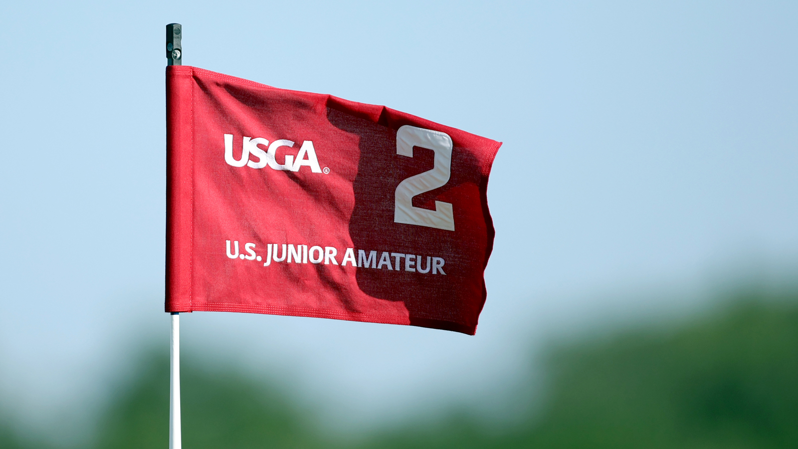 A US Junior Amateur flag in the wind