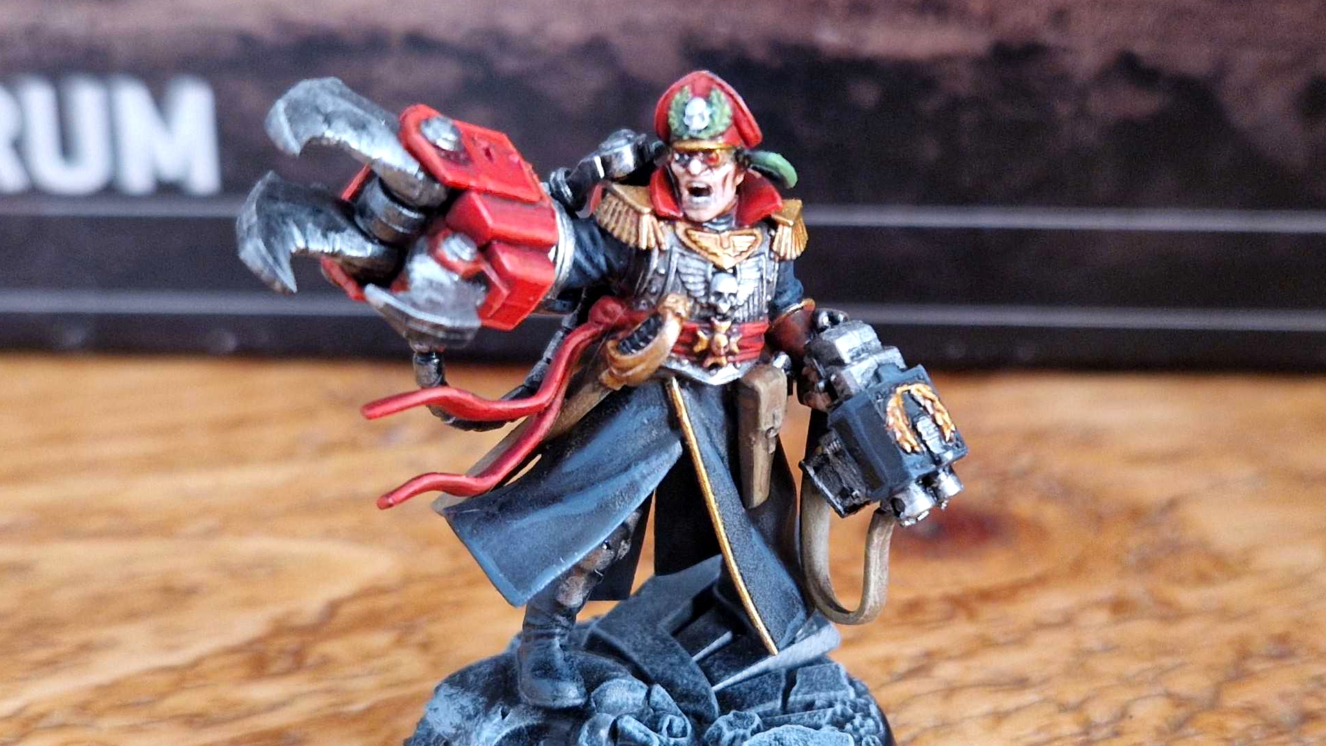 Commisar Yarrick moniature reaching out with a large clawed hand