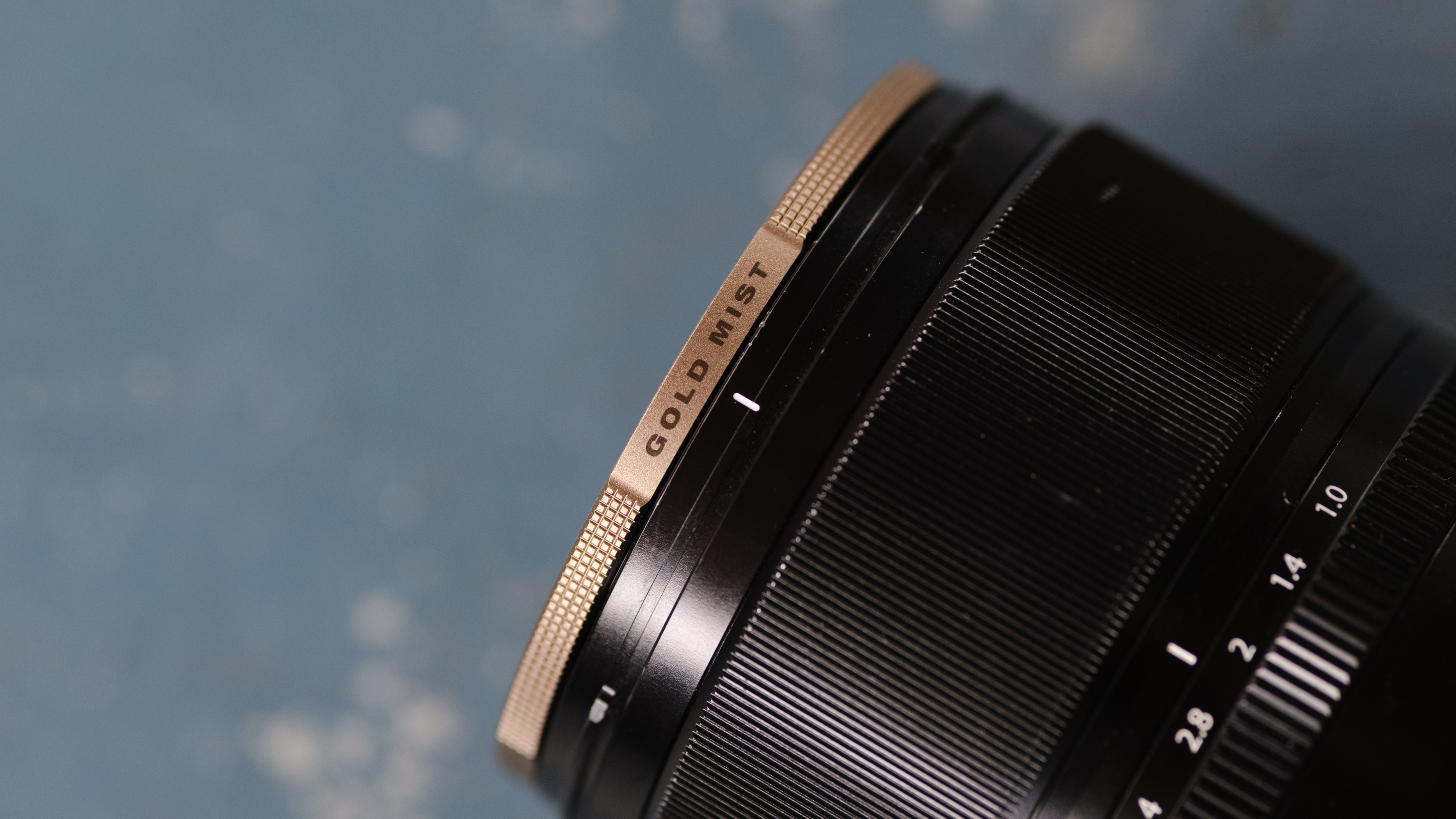 The Polar Pro McKinnon 135 Gold Mist filter on a camera lens