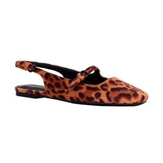 A cut out of a leopard print flat shoe on a white background