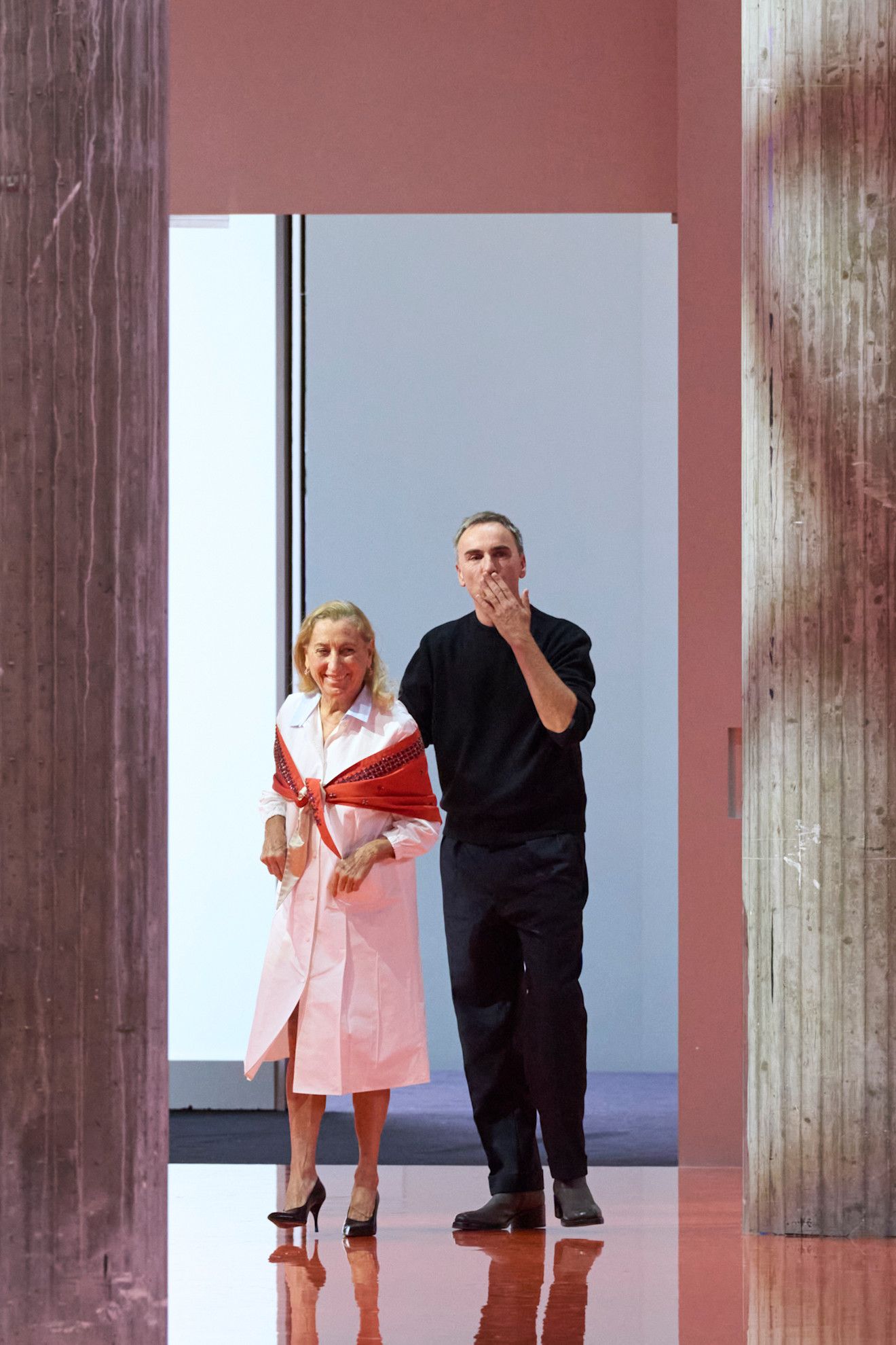 Miuccia Prada and Raf Simons at the end of the Prada spring/summer 2026 runway show.