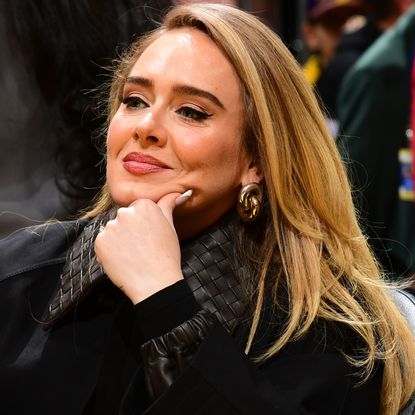 Adele was spotted on vacation wearing a Team England sports jersey, the flip-flops trend, and a Hermès Birkin Bag