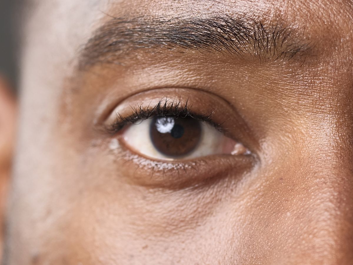 Studio portrait closeup of model's eye and the focus is on the eyelash