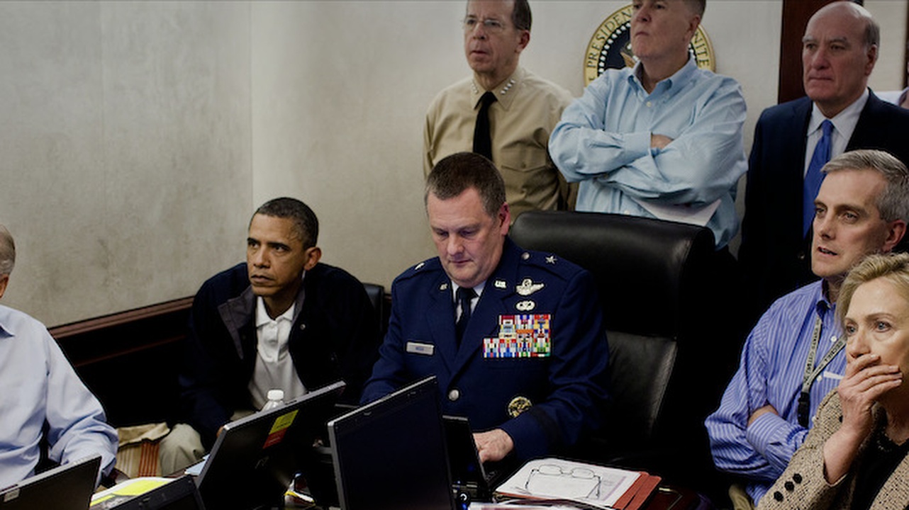 Still from American Manhunt: Osama bin Laden showing President Obama and staff members including Hilary Clinton watching the capture of Osama bin Laden