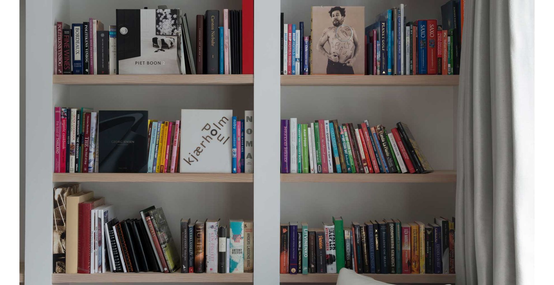 gray bookcases to show how to organize bookshelves