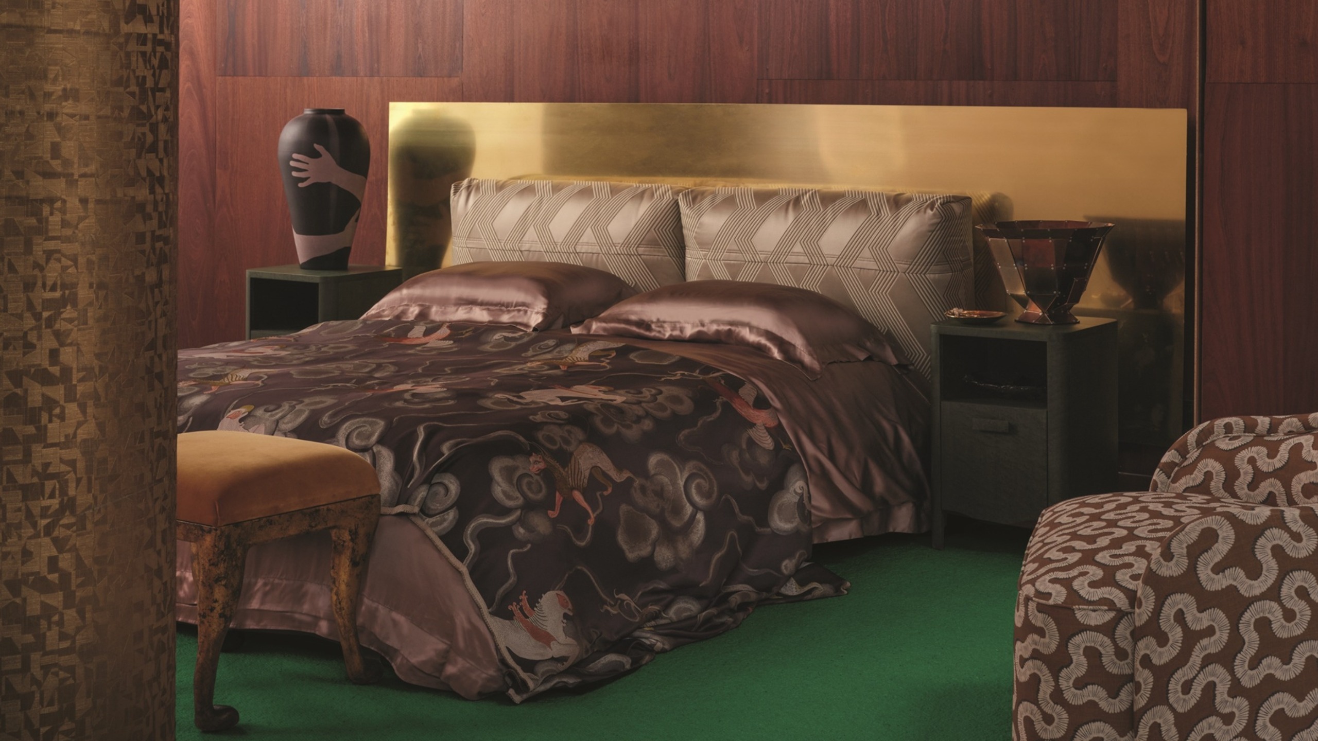 a dark wood paneled bedroom with a brass headboard and silk sheets, with a green floor