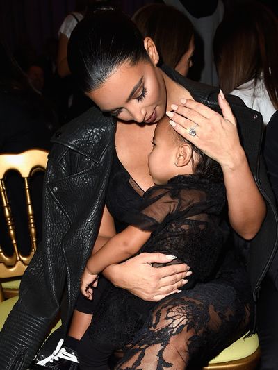 Ear, Mammal, Black hair, Interaction, Love, Wrist, Romance, Flash photography, Hug, Body jewelry,
