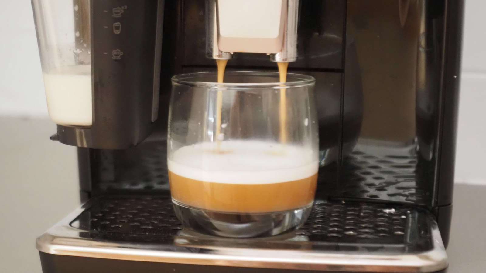 Philips 4400 Series LatteGo espresso machine pouring a flat white