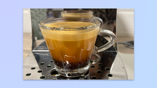 an espresso shot extracted by the smeg espresso. machine