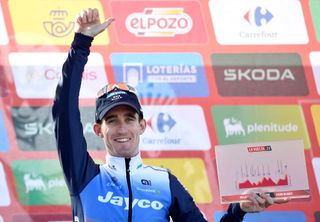 Winner of stage Team Jayco-AlUla&#039;s Eddie Dunbar celebrates on the podium after the stage 20 of the Vuelta a Espana, a 172 km race between Villarcayo and Picon Blanco, on September 7, 2024. (Photo by ANDER GILLENEA / AFP)