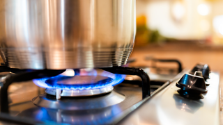 Closeup of pan on gas cooktop