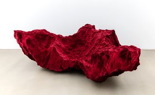 Appearing like rocks quarried from the surface of Mars, the ‘Species’ armchairs (pictured) are hand carved from synthetic foam before being covered in Rothko-inspired red velvet