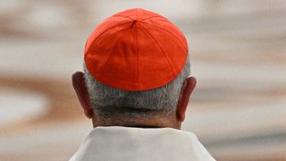 This photograph shows a cardinal with a red zucchetto as skullcap during the Eight Novemdiale mass, following the funeral of the pope and ahead of the conclave, at the St Peter's Basilica in The Vatican, on May 3, 2025. (Photo by Andreas SOLARO / AFP) (Photo by ANDREAS SOLARO/AFP via Getty Images)