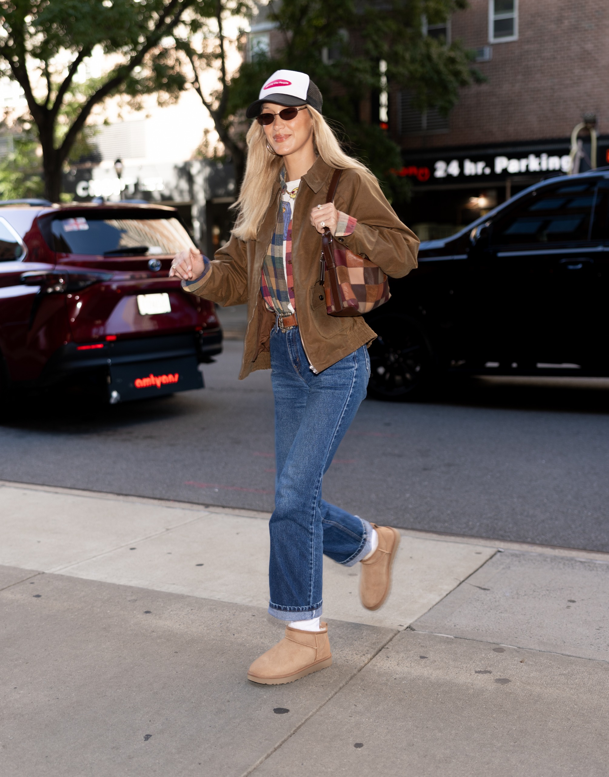 Bella Hadid arrived at New York Fashion Week in a patchwork Coach bag and Ugg boots