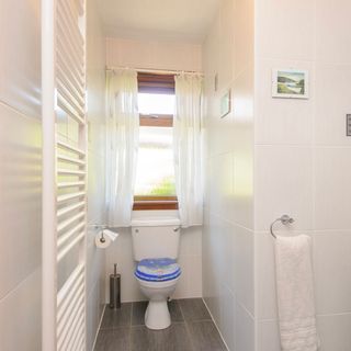 white bathroom with towel rail