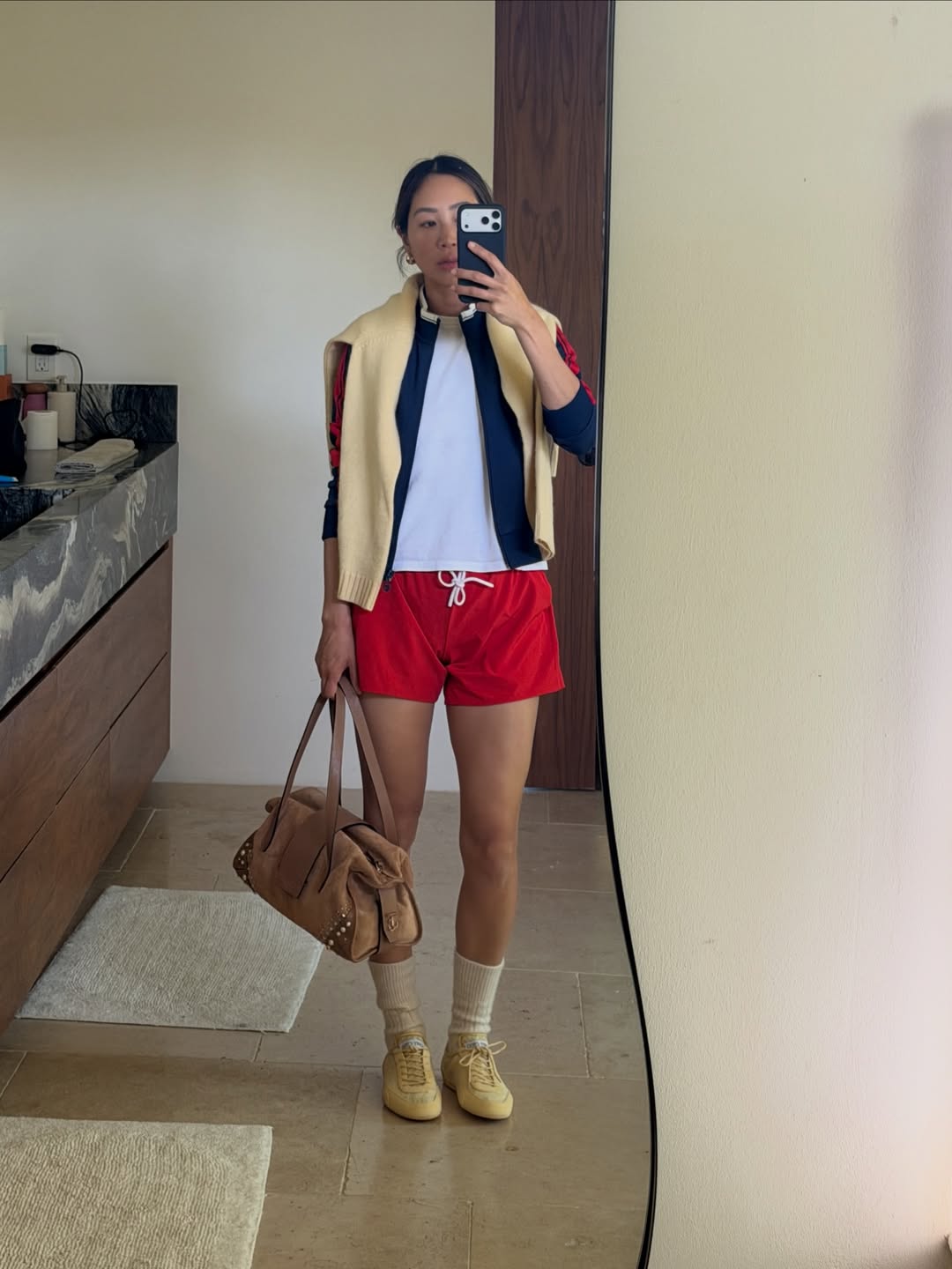 Aimee Song in slim sneakers.