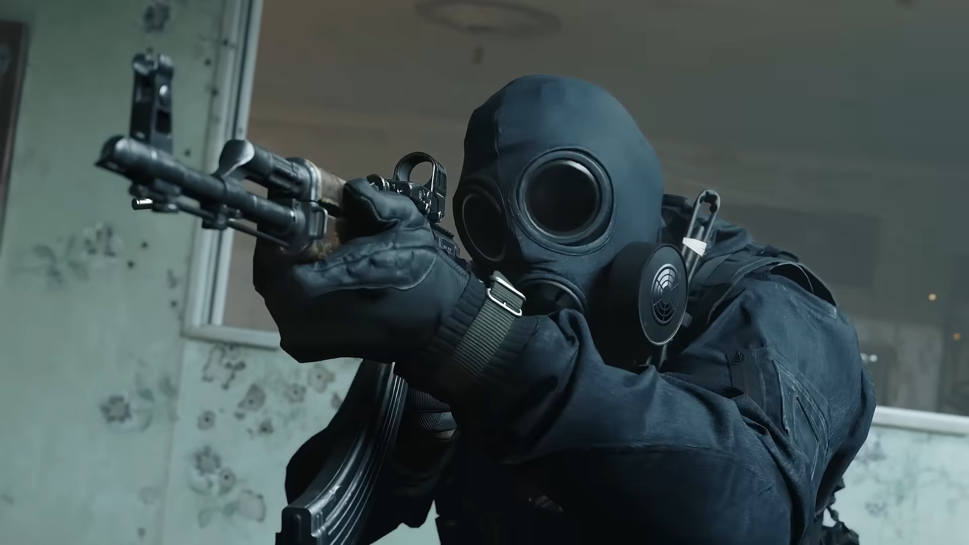 Call of Duty Modern Warfare 4 screenshot from beta weekend 1 trailer showing a soldier in dark clothing with a gas mask aiming a gun