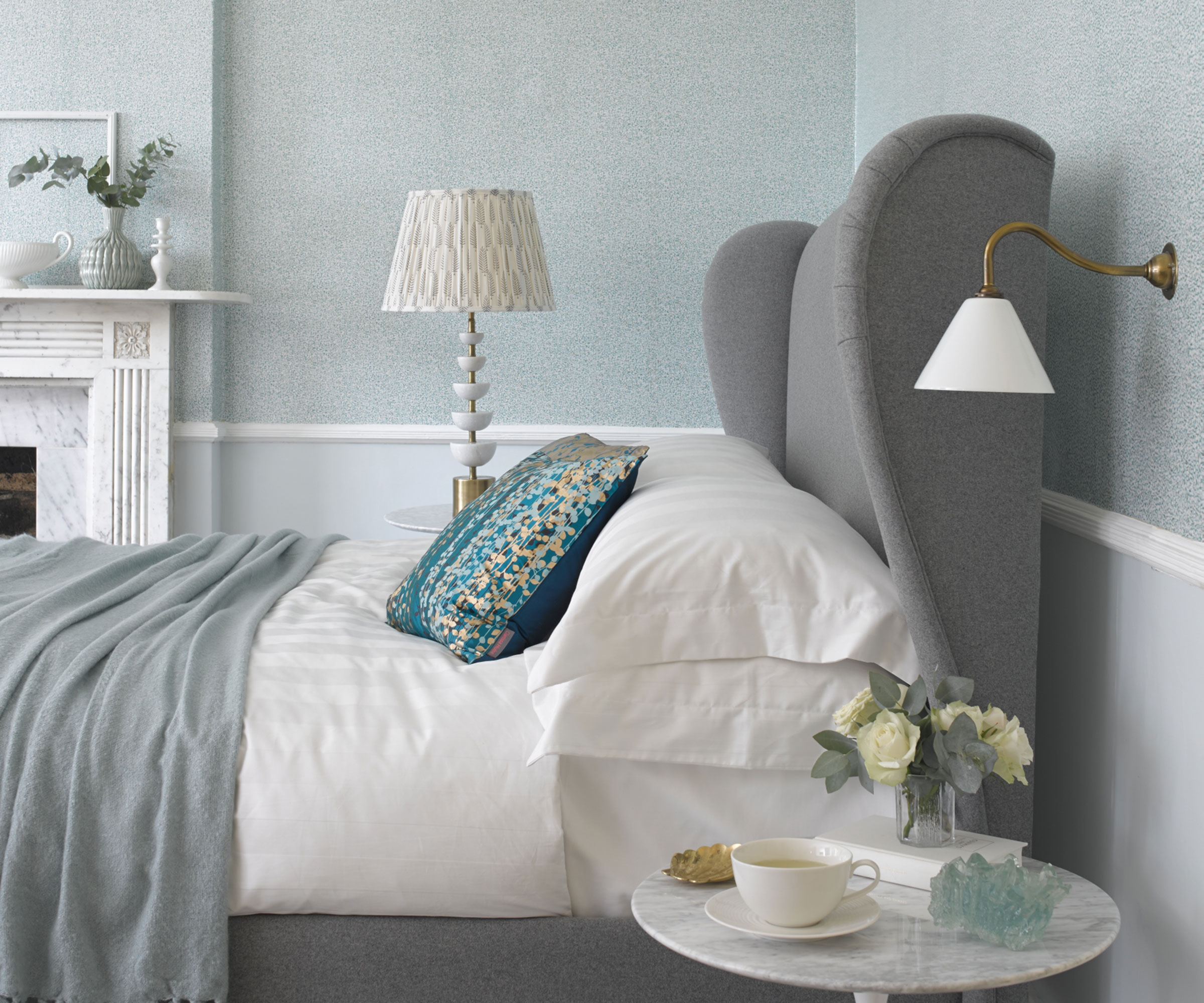 grey bedroom with marble fireplace