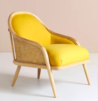 Yellow accent chair with rattan accents
