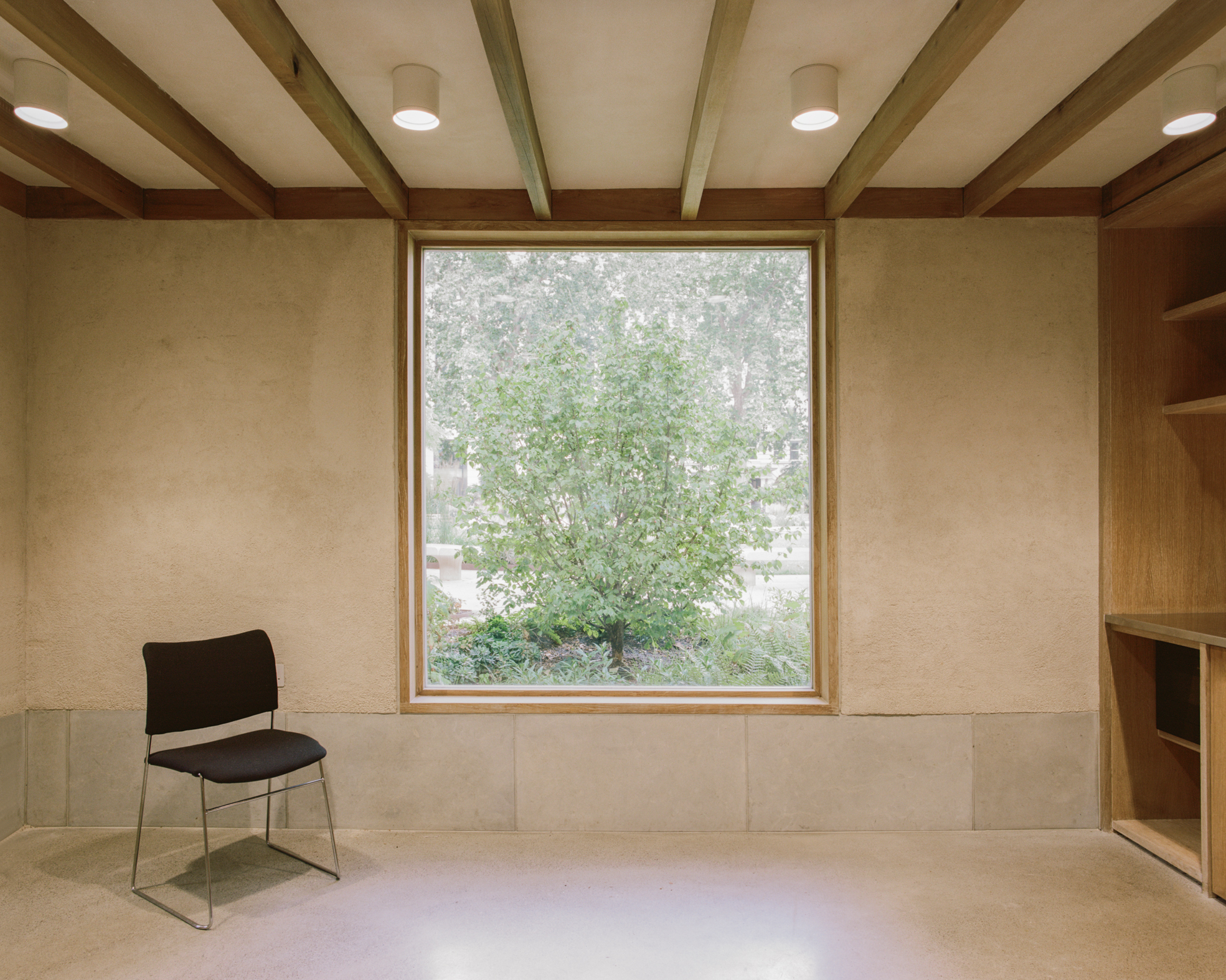 view of Finsbury Circus Parks Office, a minimalist, earthy building set among leafy garden