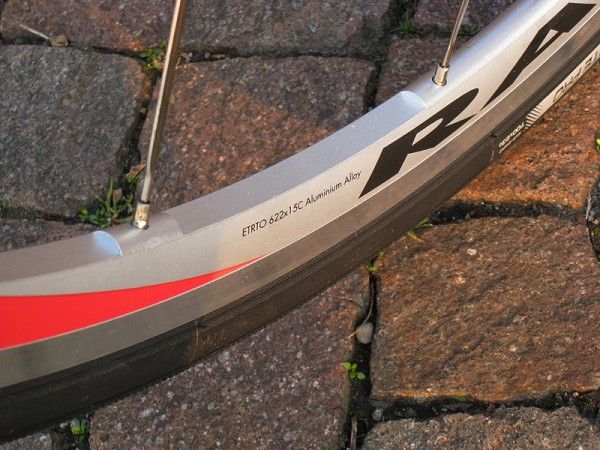 The aluminium rims are milled in between the spoke holes to shave weight.