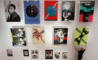 Roman Cieslewicz posters being installed at the Royal College of Art