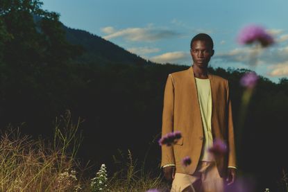 Man wearing Oasi Cashmere Zegna suit in Alps