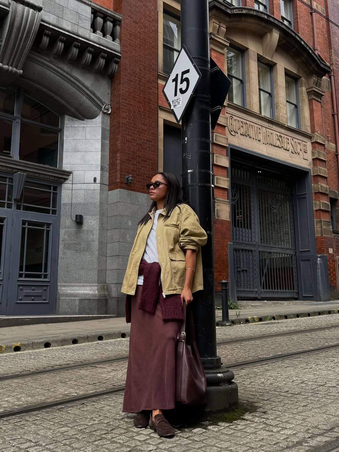 woman wearing brown maroon color trend fall 2025