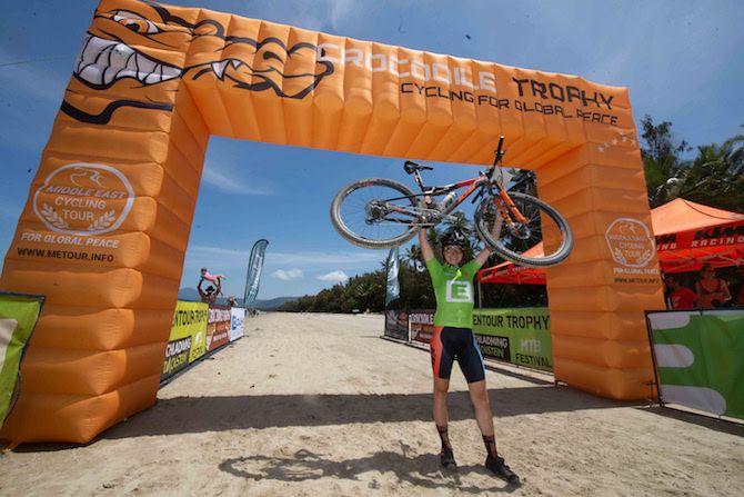 Austria's Angelika Talreiter celebrates crossing the finish line of the final stage in Port Douglas as the winner of the elite women's category at the 2019 Crocodile Trophy