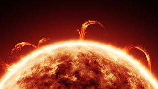a close-up of the sun shows a giant ball of fire in space