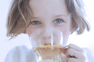 Little girl drinking tea