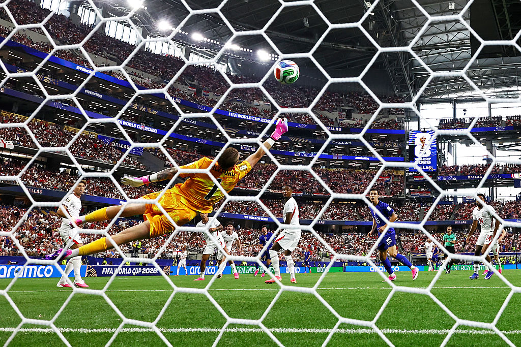 Jordan Pickford dives in vain against Croatia