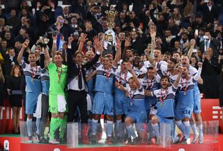 Lazio players and coach Simone Inzaghi celebrate victory over Atalanta in the 2019 Coppa Italia final.