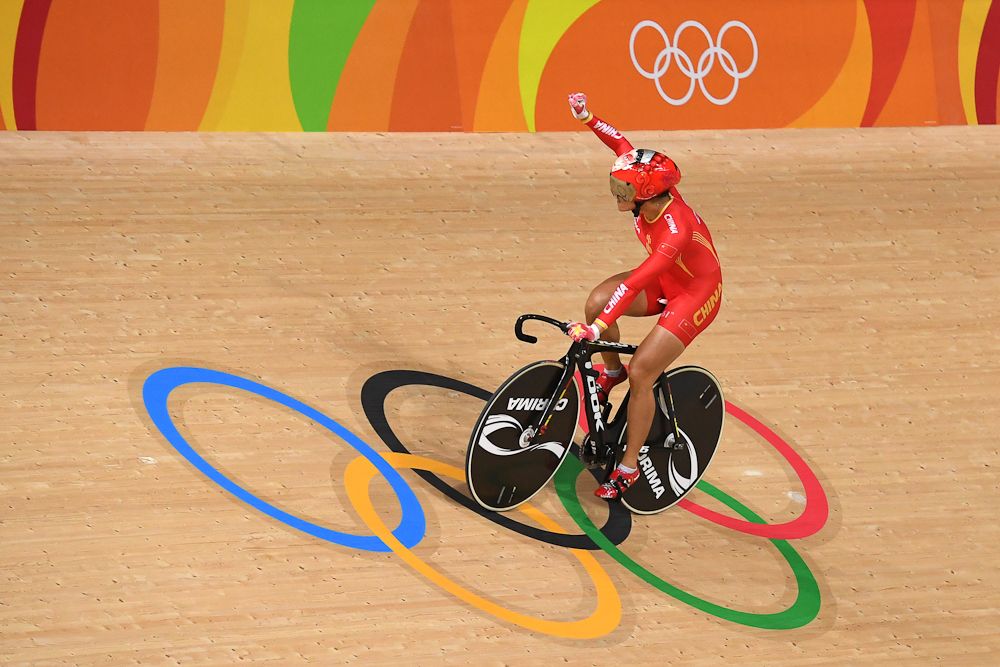 China's Gong Jinjie celebrates after winning gold in the women's Team Sprint