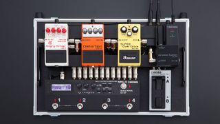 Best pedalboards buying advice: Boss pedals and pedal switcher on a black and silver pedalboard