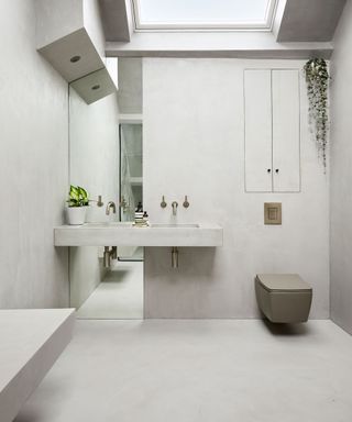 Cloakroom with grey concrete walls and flooring