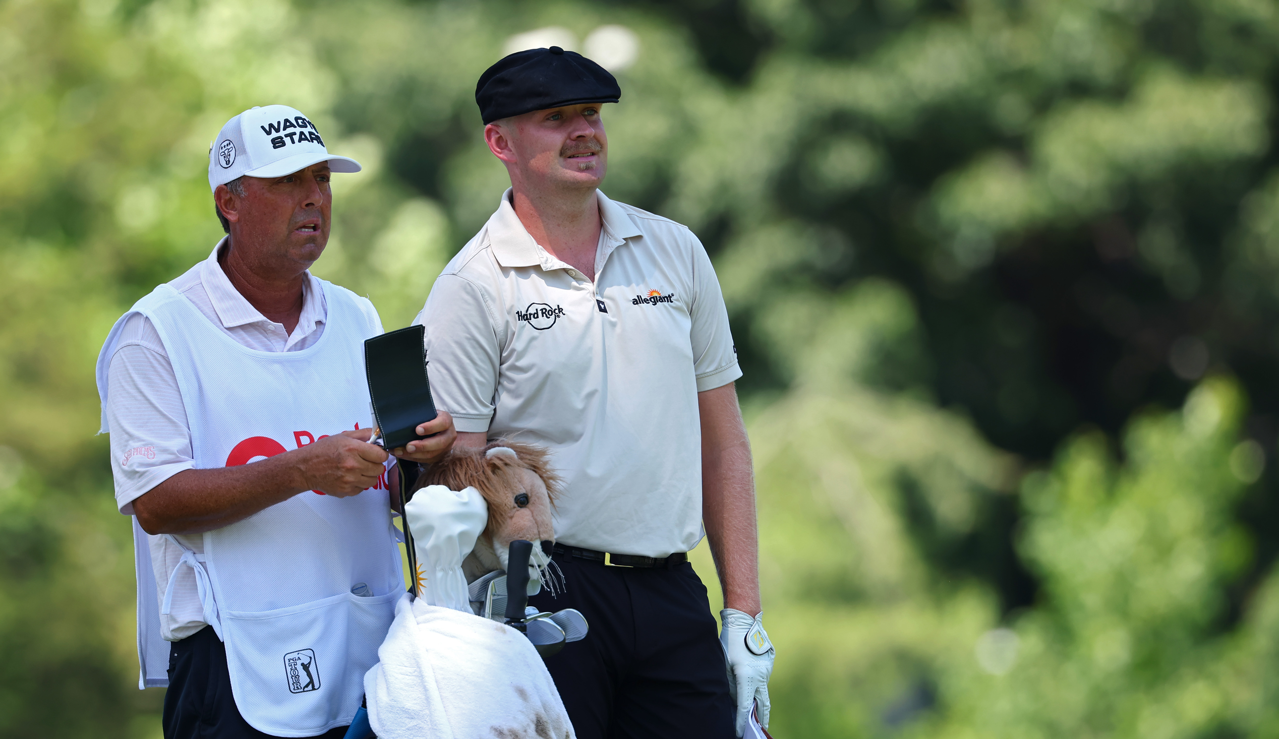 Harry Hall speaks to his caddie