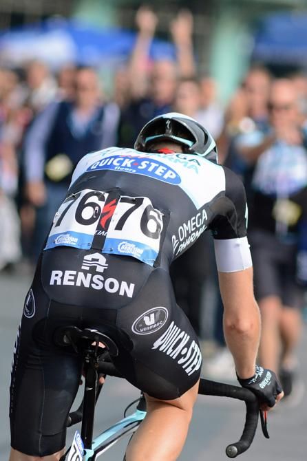 Julien Vermote rides to his celebrating Omega Pharma staff