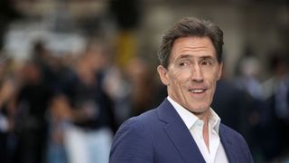 Rob Brydon smiles at the UK premiere of Swimming With Men