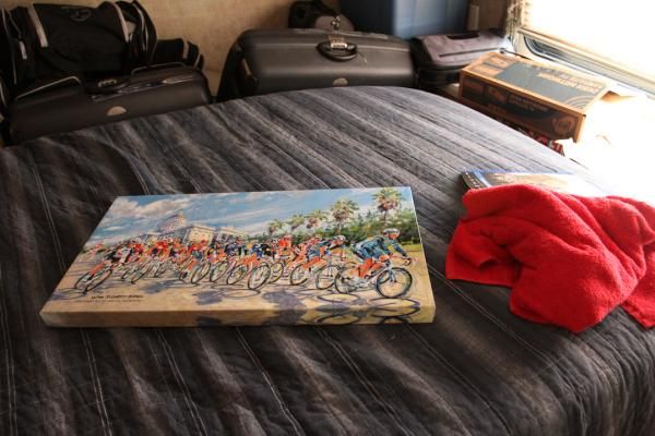 For winning stage one in Sacramento, Mark Cavendish was presented this oil painting depicting a peloton and the iconic state capitol building. The painting rests on the bed of the team bus.