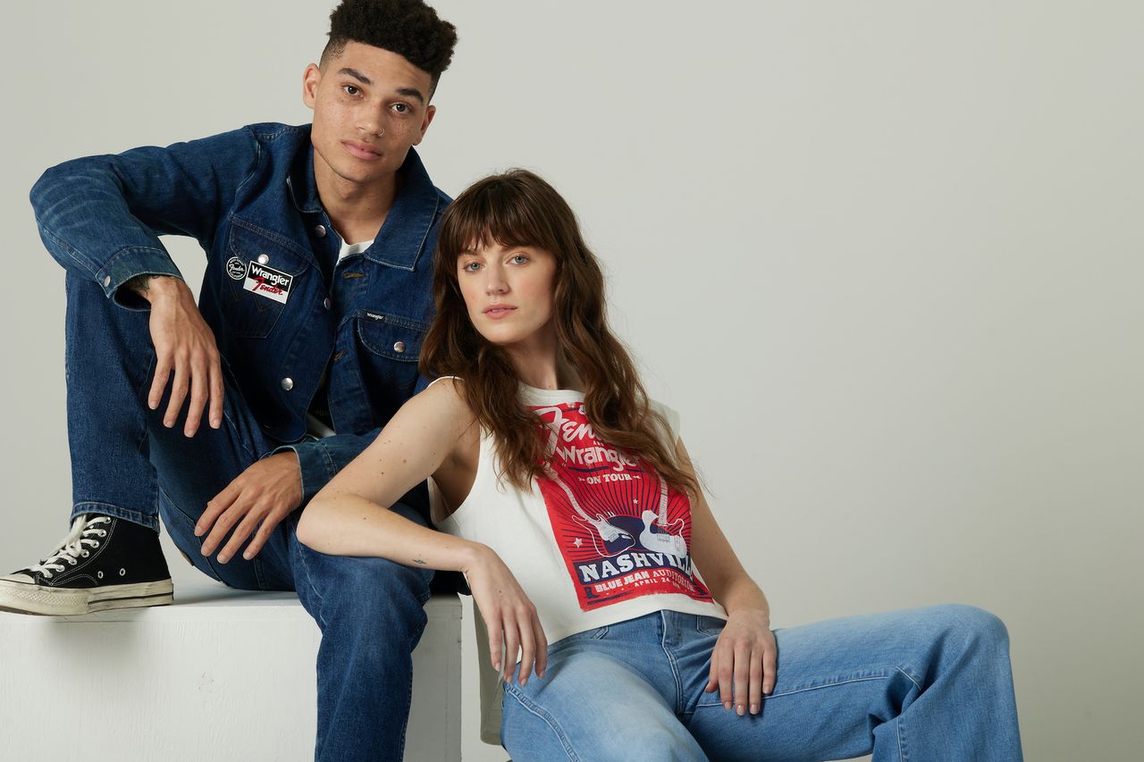 Two models model clothing items in the Fender x Wrangler collection
