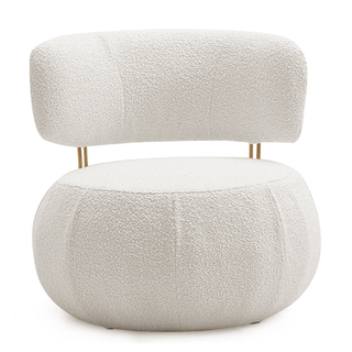 A round geometric boucle accent chair with gold hardware