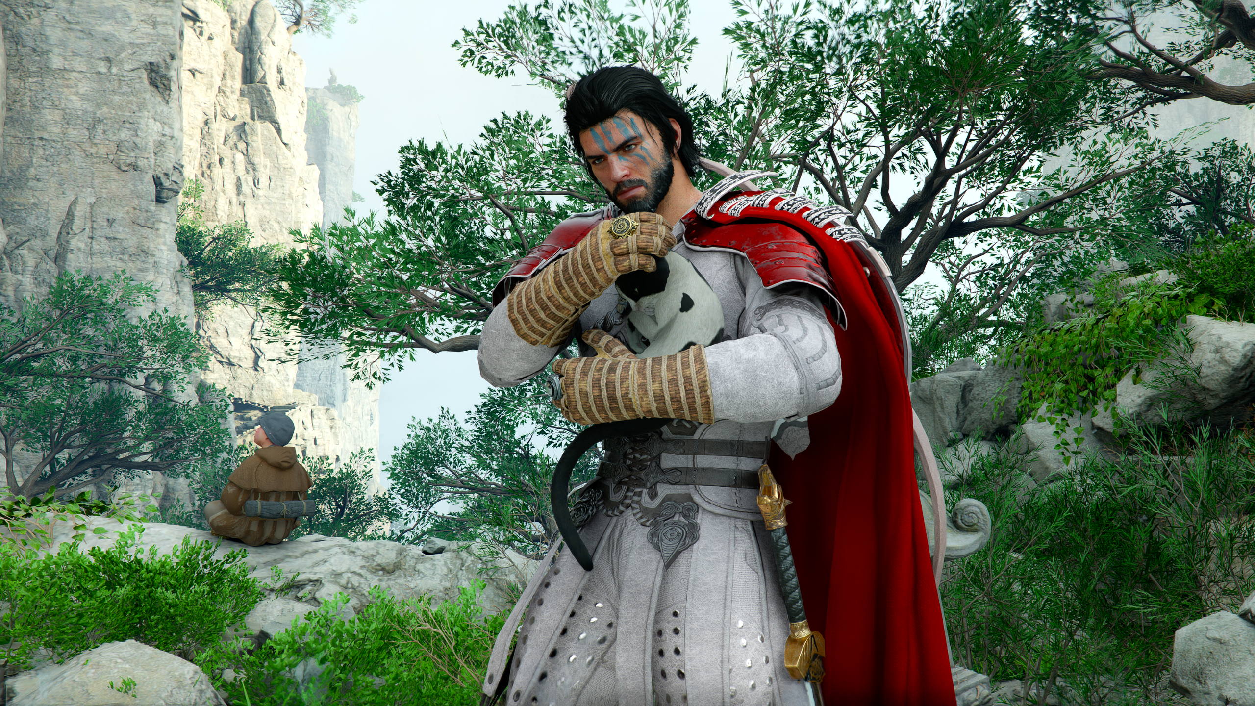 Kliff holding a kitten in Crimson Desert