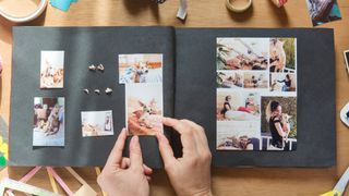 best ways to memorialize your pet — person making a scrap book