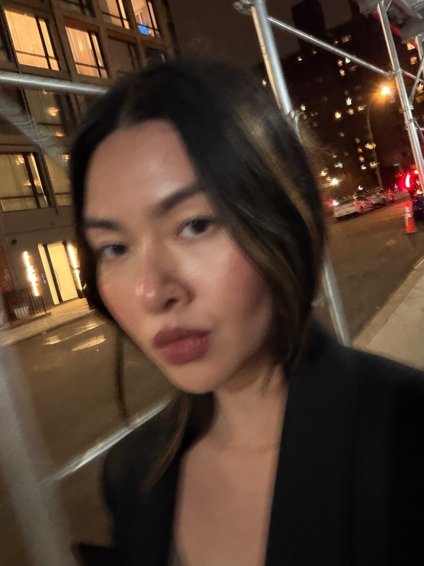 Creator @mimixn taking a blurry selfie with glowing skin