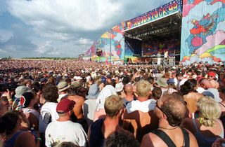 a medium shot of the crowd and stage at Woodstock 99